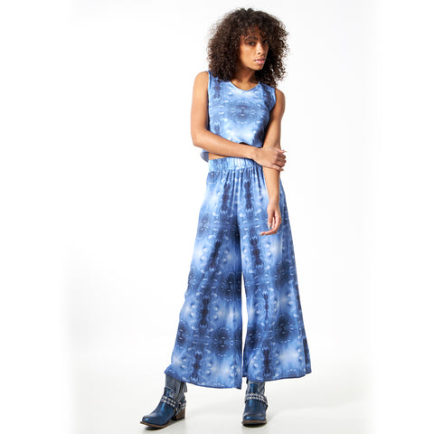 Model in Brooklyn Bridge printed wide leg pants and cropped tank top