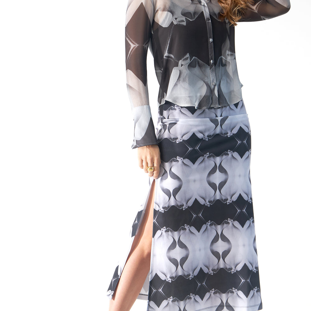 
                  
                    Babs Body-Hugging Midi Skirt - Black/White Stone Man Print Design
                  
                
