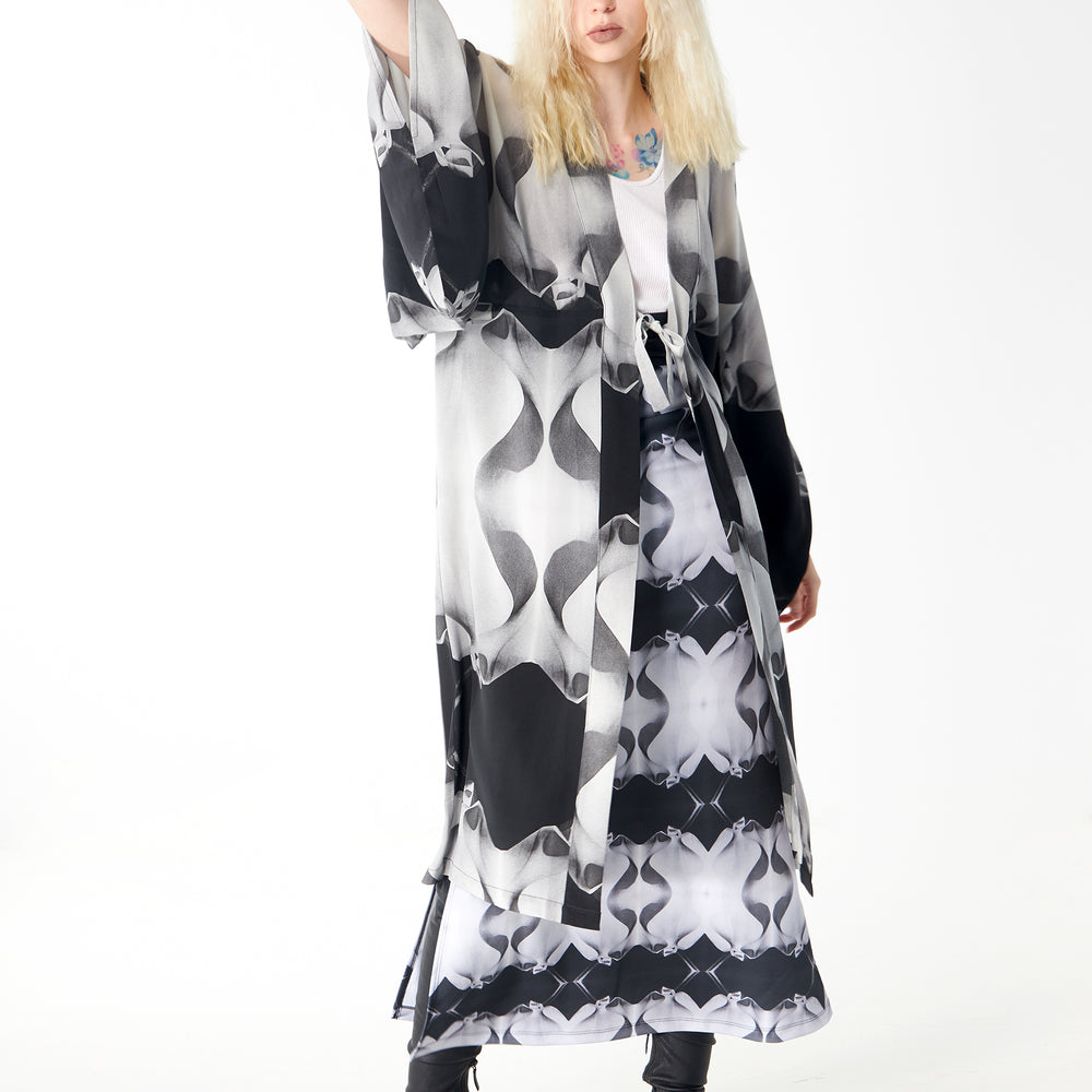
                  
                    Babs Body-Hugging Midi Skirt - Black/White Stone Man Print Design
                  
                
