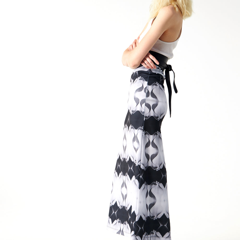 
                  
                    Babs Body-Hugging Midi Skirt - Black/White Stone Man Print Design
                  
                