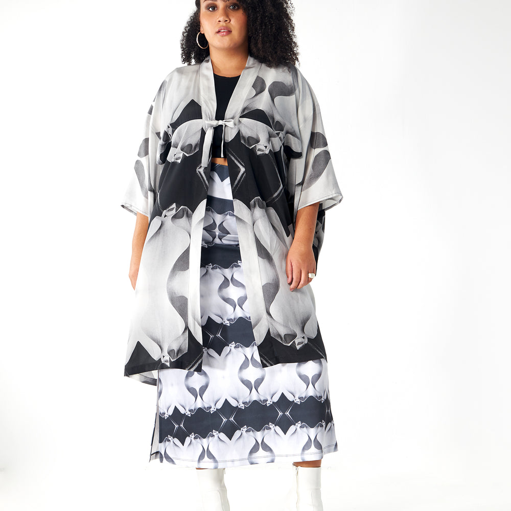
                  
                    Babs Body-Hugging Midi Skirt - Black/White Stone Man Print Design
                  
                