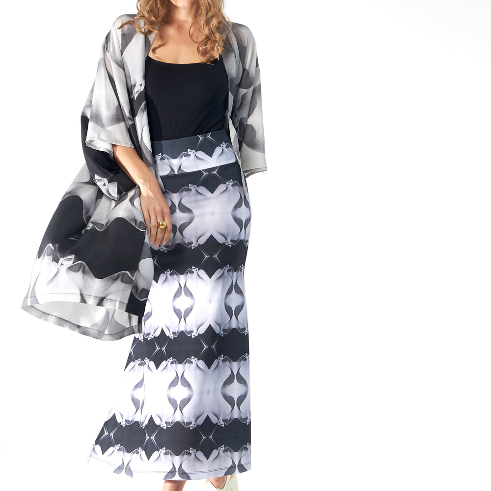 
                  
                    Babs Body-Hugging Midi Skirt - Black/White Stone Man Print Design
                  
                